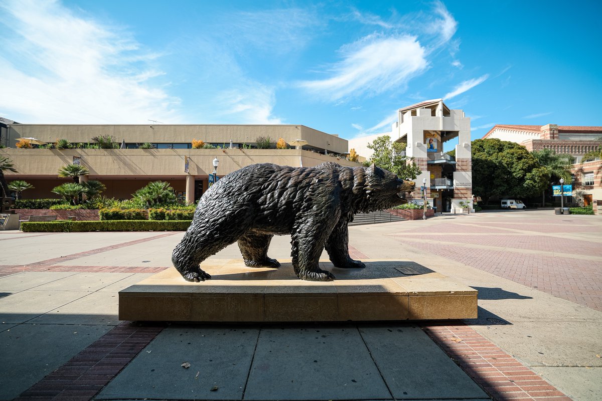 large grizzly bear statue taking pose on platform