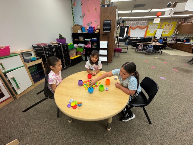 young students playing games in class