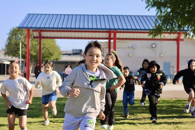students running on the playground