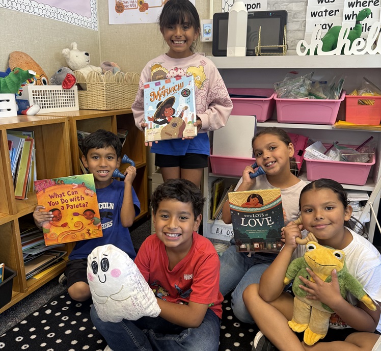 students sitting on floor with books 