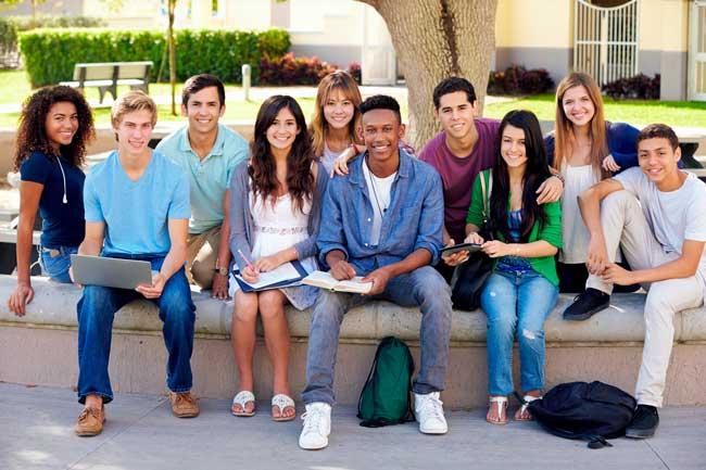 Group of teenage students sitting together